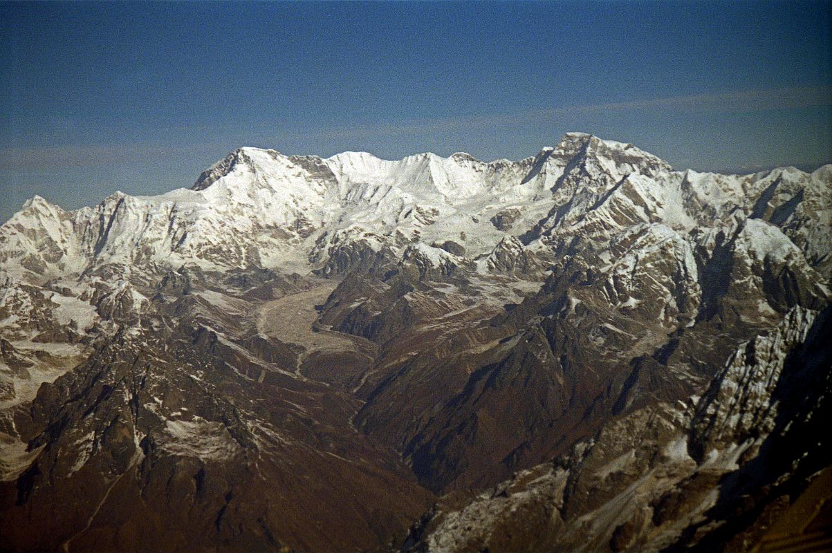 Kathmandu Mountain Flight 07-6 Cho Oyu To Gyanchung Kang With Gokyo Valley And Ngozumpa Glacier 1997 A long ice ridge connects Nangpai Gosum I (7351m) to Cho Oyu (8201m) to the little known Gyachung Kang (7952m), the 15th highest mountain in the world. The Gokyo Valley snakes up to the Ngozumpa Glacier, the largest in Nepal.